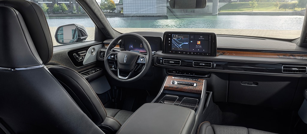 The front cabin of a 2025 Lincoln Black Label Nautilus® SUV is shown in the Invitation interior theme