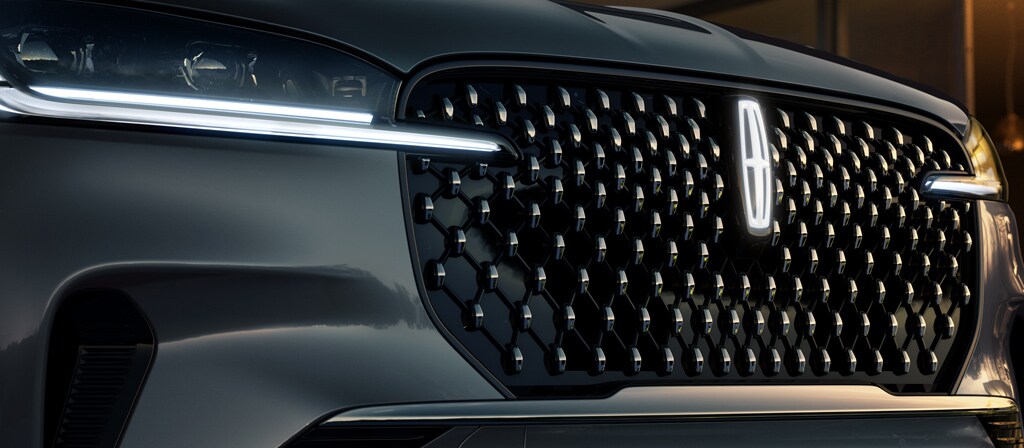 A Lincoln Star logo glows in the center of the grille on a 2027 Lincoln Aviator® Black Label™ SUV