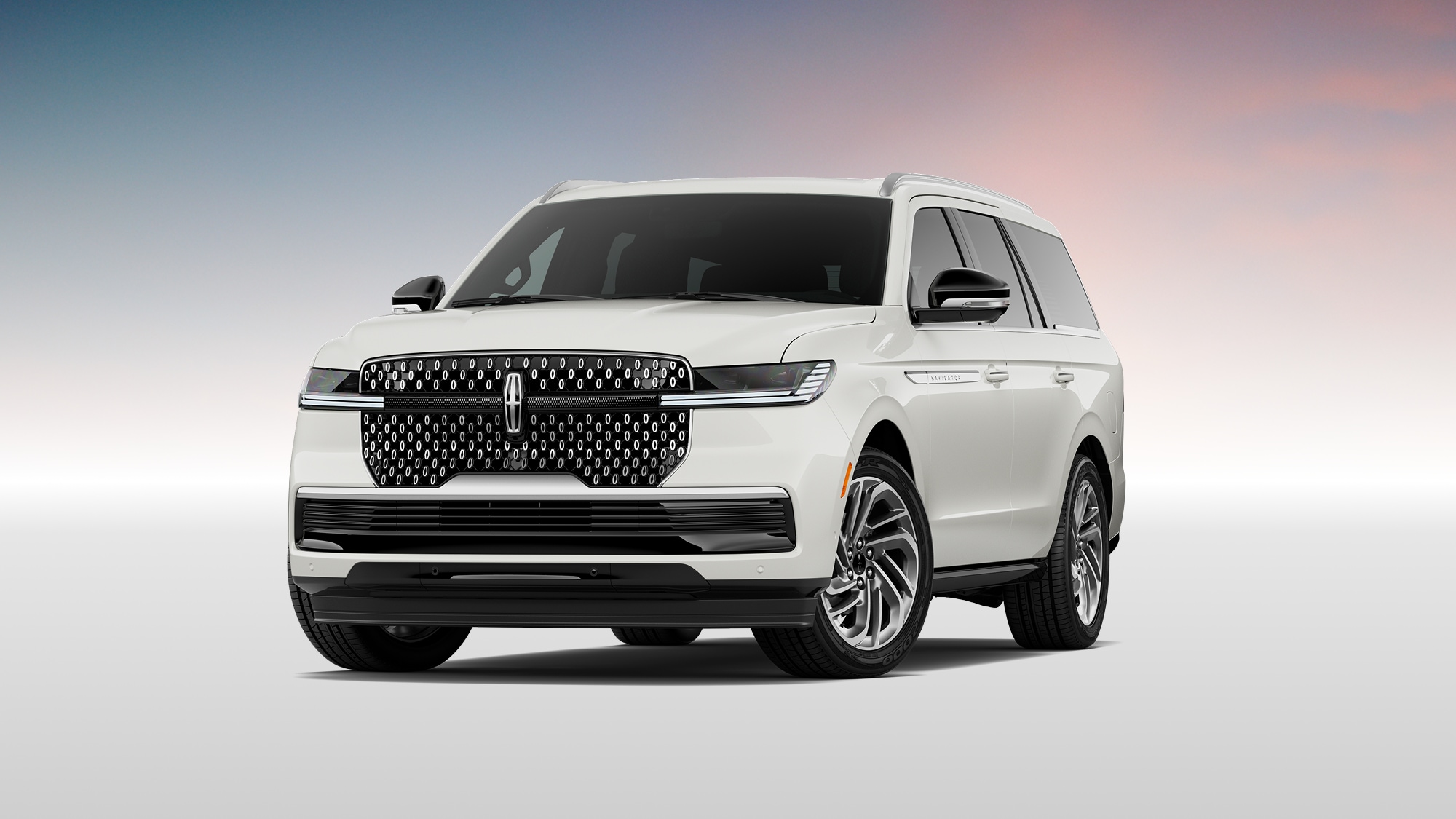 Navigator shown in Pristine White Metallic Tri-coat.