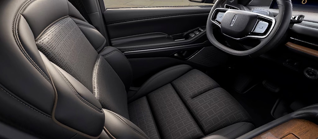 A repeating pattern in the leather seating surface of the Invitation theme represents a pergola