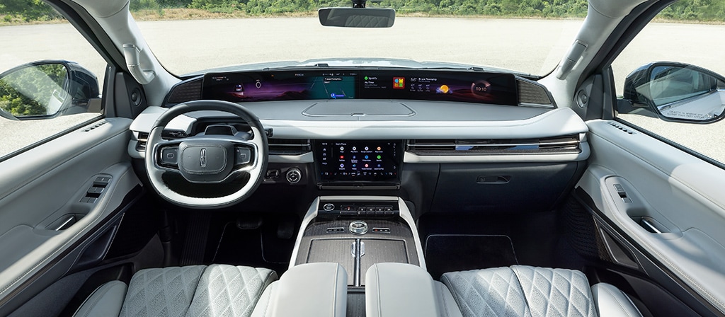 The panoramic display spans the width of a 2026 Lincoln Black Label Navigator® SUV with the Atmospheric interior theme