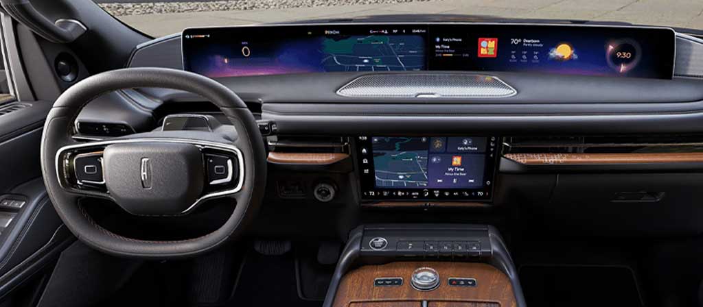 The front cabin of a 2027 Lincoln Navigator® Black Label™ SUV in the Invitation theme