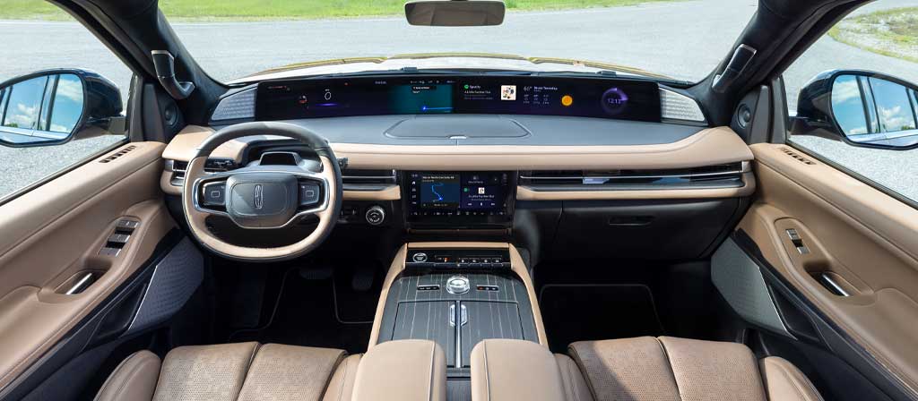 The interior of a 2027 Lincoln Navigator® Black Label™ SUV plays host to a dramatic panoramic display