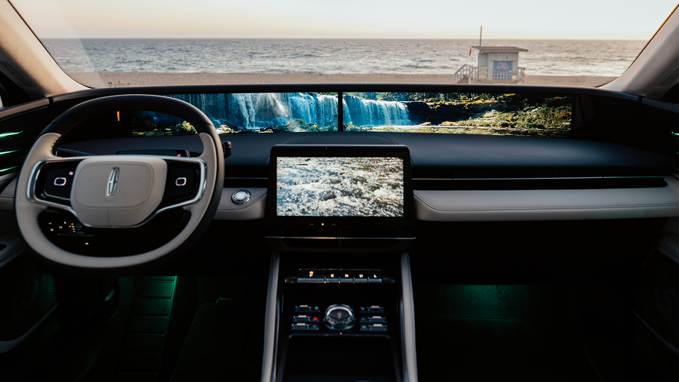 Interior view of the Lincoln cabin showing the steering wheel, center touchscreen, and Panoramic Display.