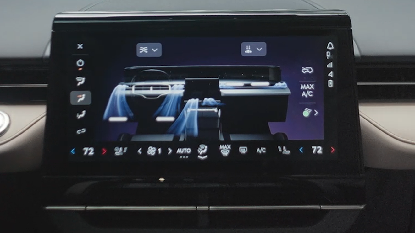 Close-up of the Lincoln center touchscreen displaying the climate control interface and settings.