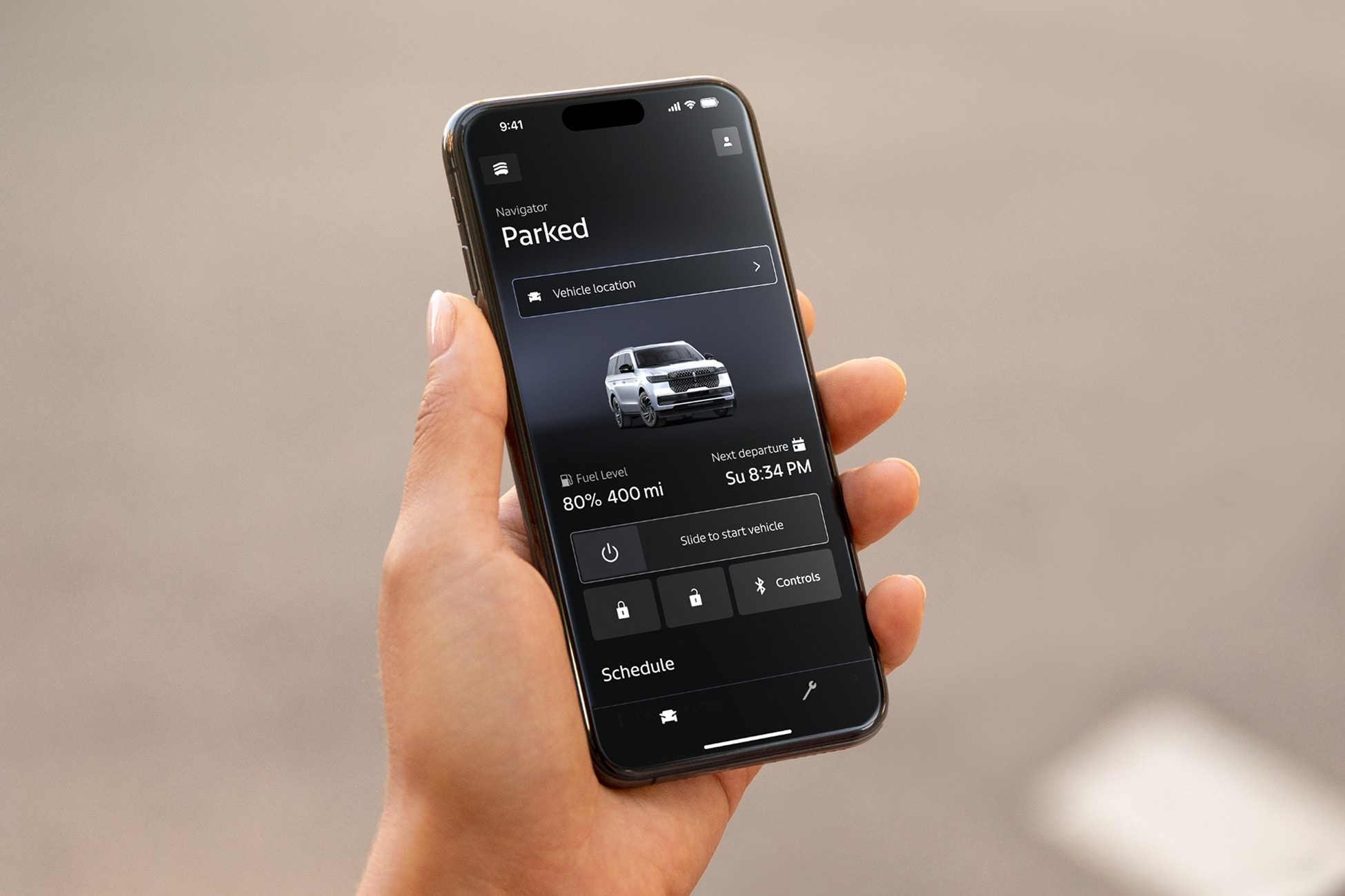 Someone is shown holding a mobile device displaying the Lincoln app.
