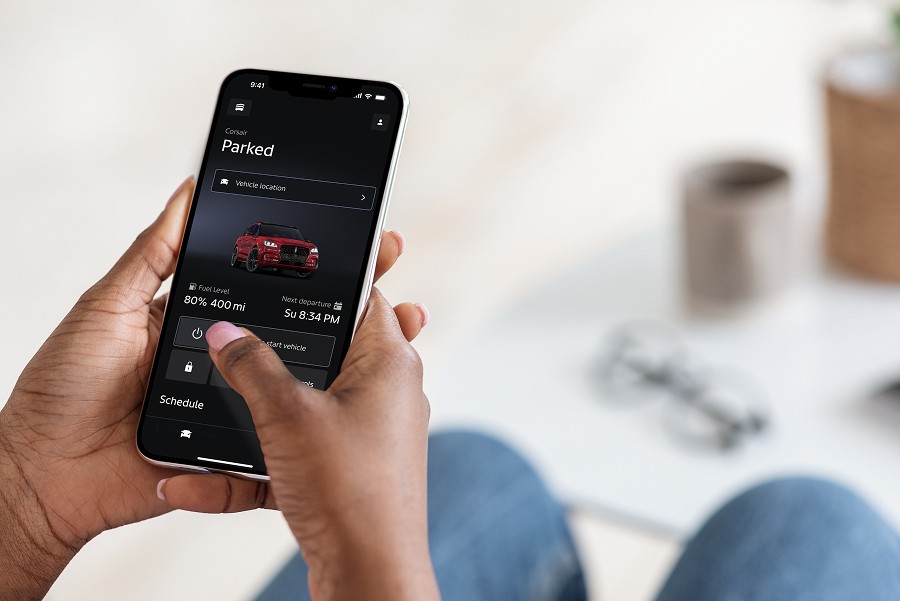 A woman’s hand using the Lincoln app is shown here