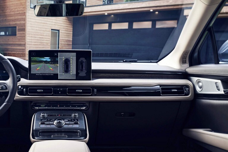 The interior of a Lincoln M K C is being shown in Charcoal