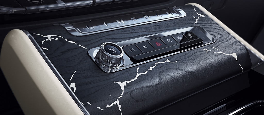 The center console of a 2025 Lincoln Black Label Aviator® SUV with marble-like applique