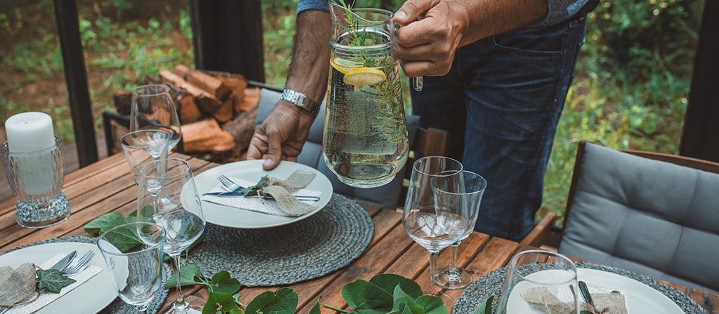 A dining table is being set to replicate the inspiration for the 2025 Lincoln Black Label invitation theme