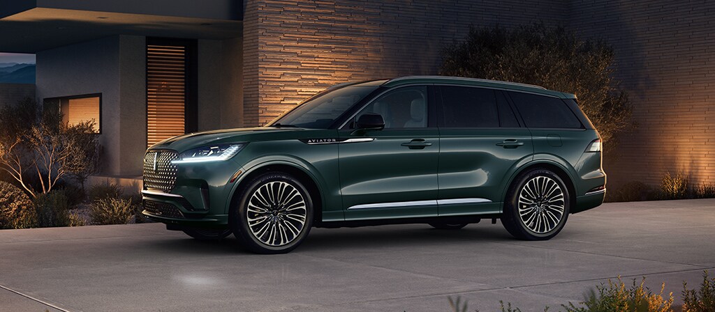 A 2026 Lincoln Black Label Aviator® SUV is parked in the driveway of modern home in the southwest