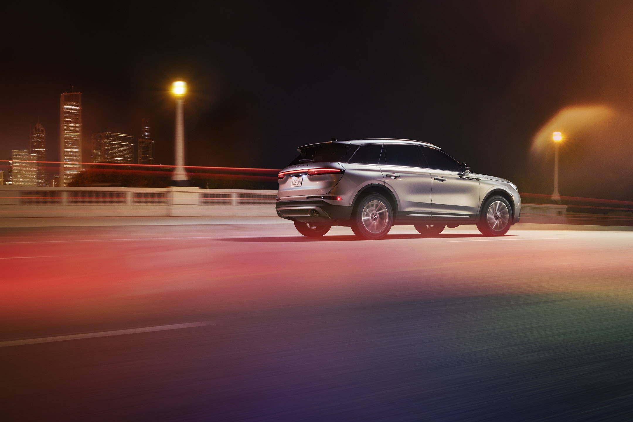 A 2024 Lincoln Corsair® SUV is being driven on a freeway at night