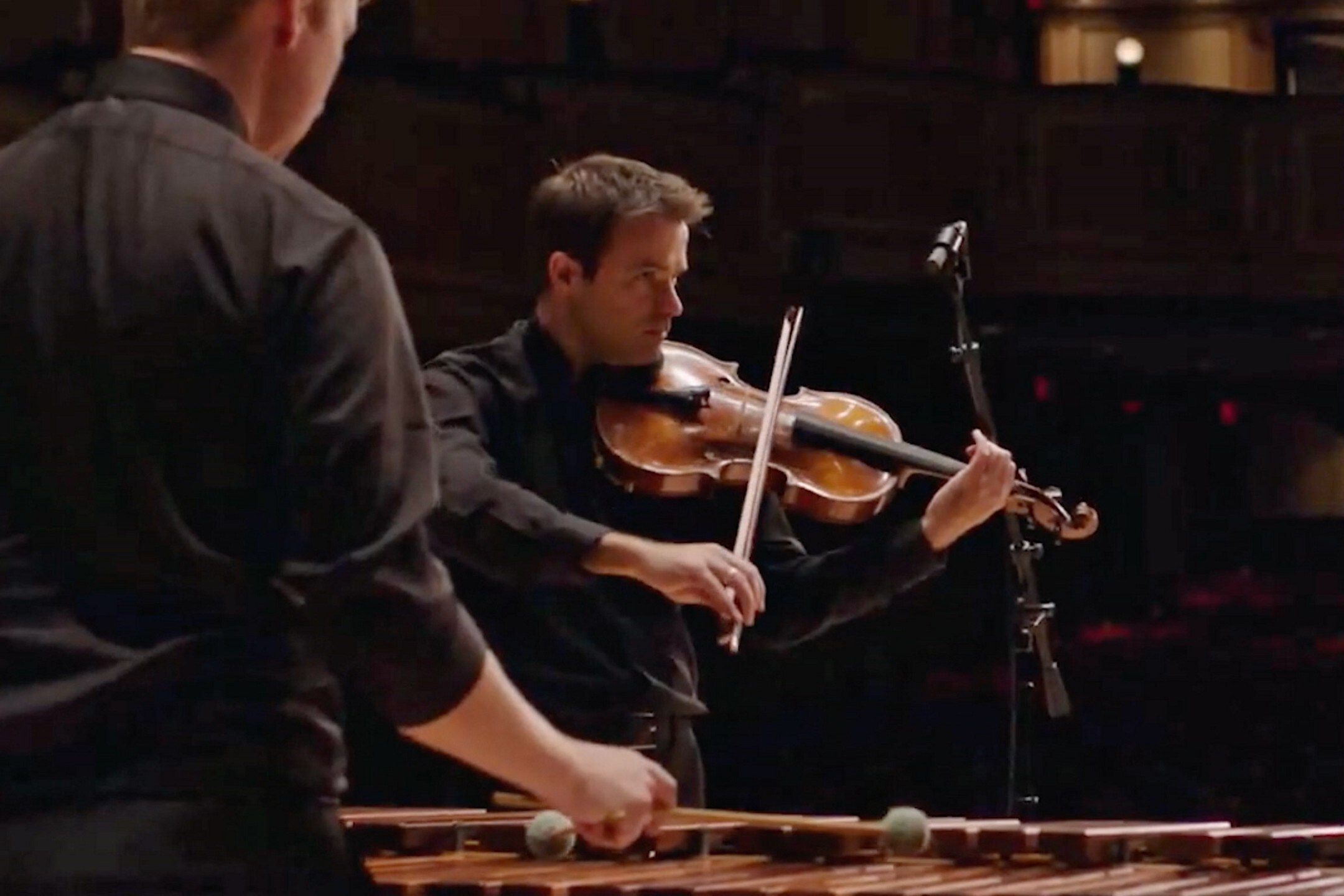 A man playing a violin.