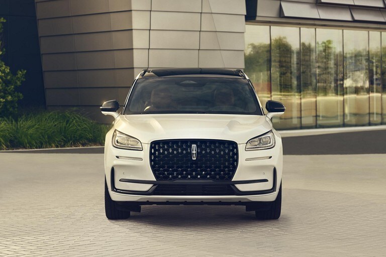 The dazzling LED headlamps of a 2024 Lincoln Corsair® SUV sparkle in the sunlight