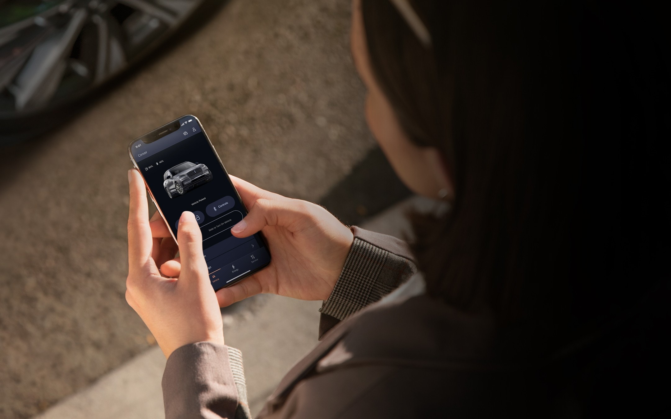 A woman using her smartphone and accessing the Lincoln Way app.