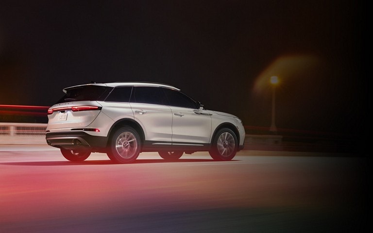 A 2025 Lincoln Corsair® SUV is being driven on a highway at night