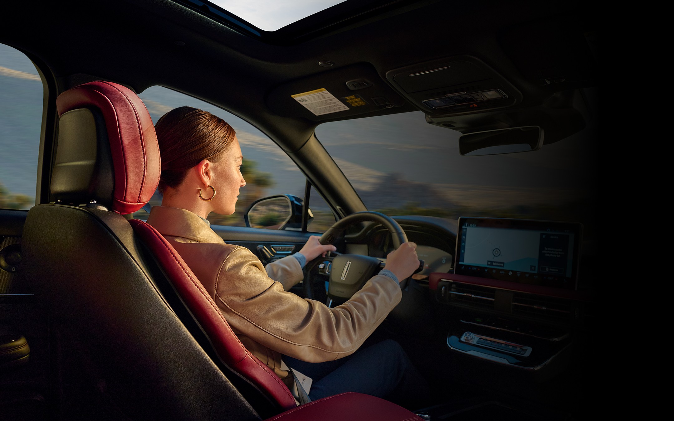 A woman driving inside the 2025 Lincoln Corsair.