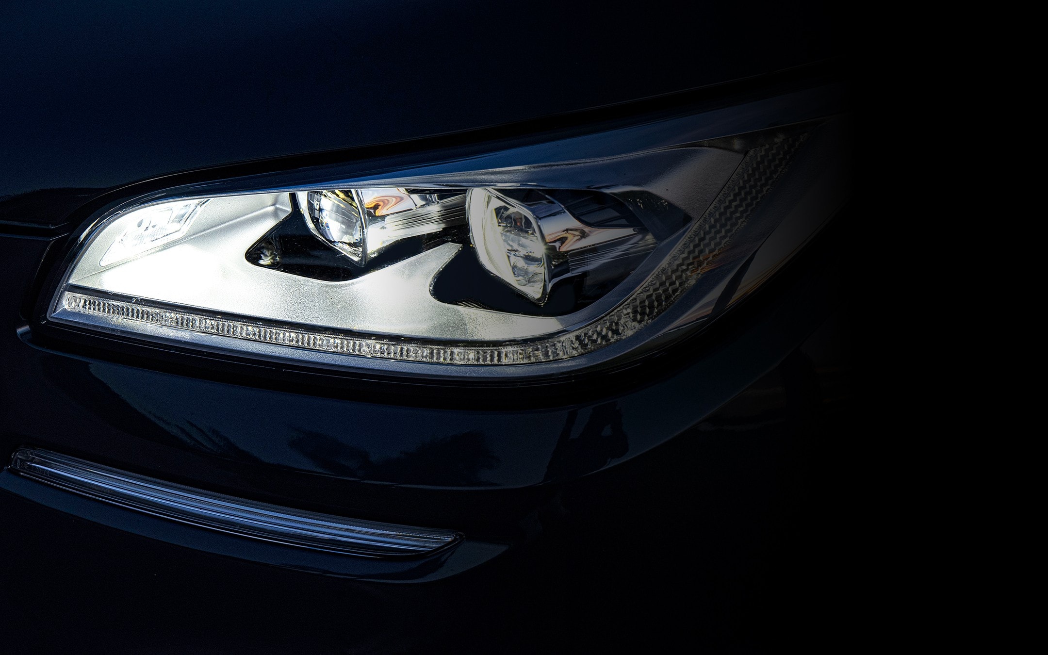 The rear of a 2025 Lincoln Corsair® Grand Touring model is shown with LED Brake lights illuminated