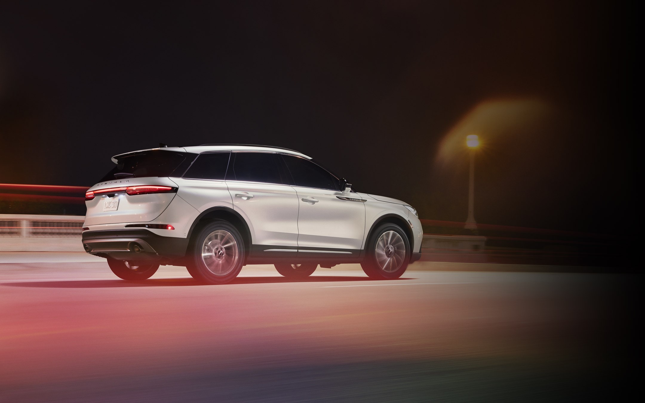 A 2026 Lincoln Corsair® SUV is being driven on a highway at night