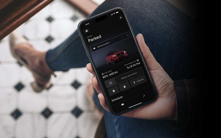 A woman using her smartphone and accessing the Lincoln Way app