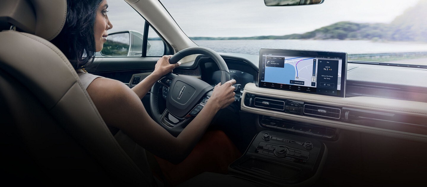 The interior of a 2023 Lincoln Nautilus® SUV Black Label shows open space and comfortable seating