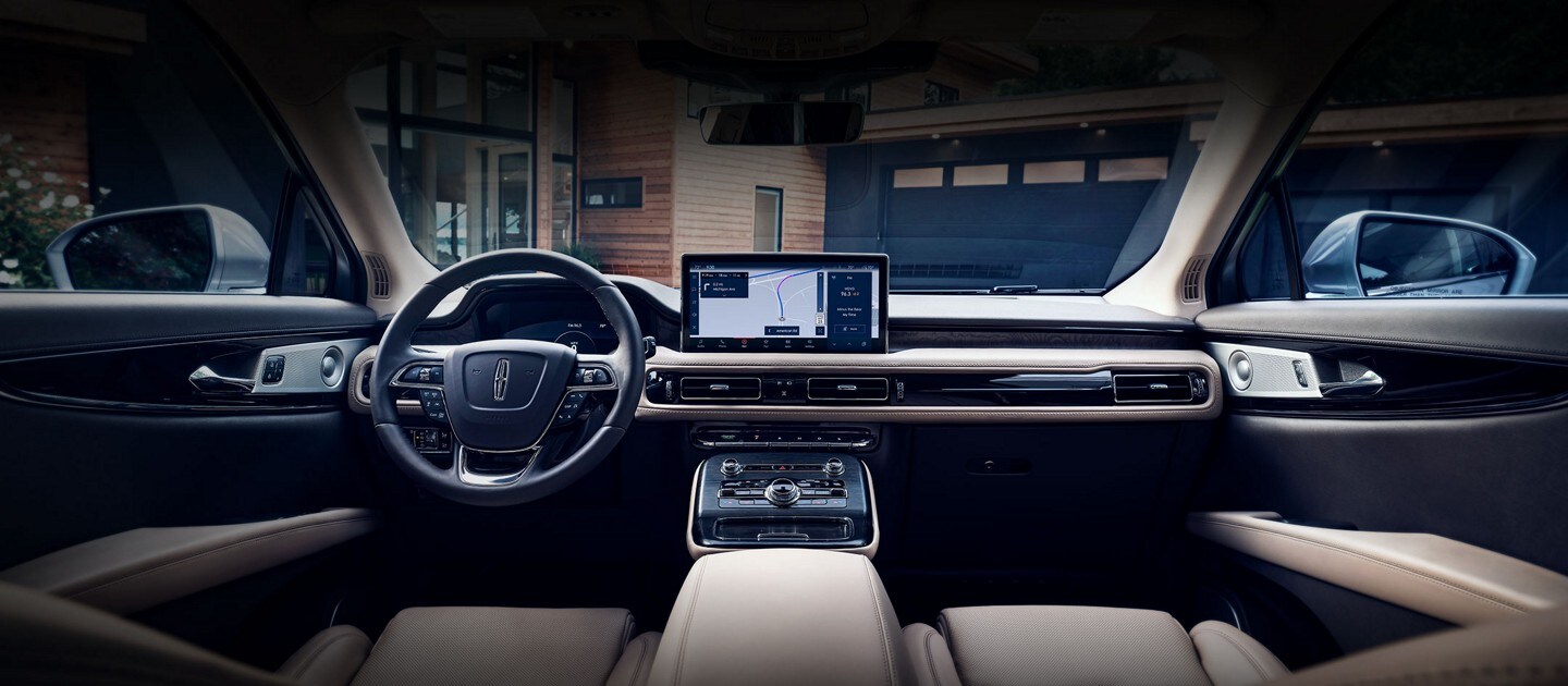 The expansive front cabin of a 2023 Lincoln Nautilus® SUV is shown from the second row
