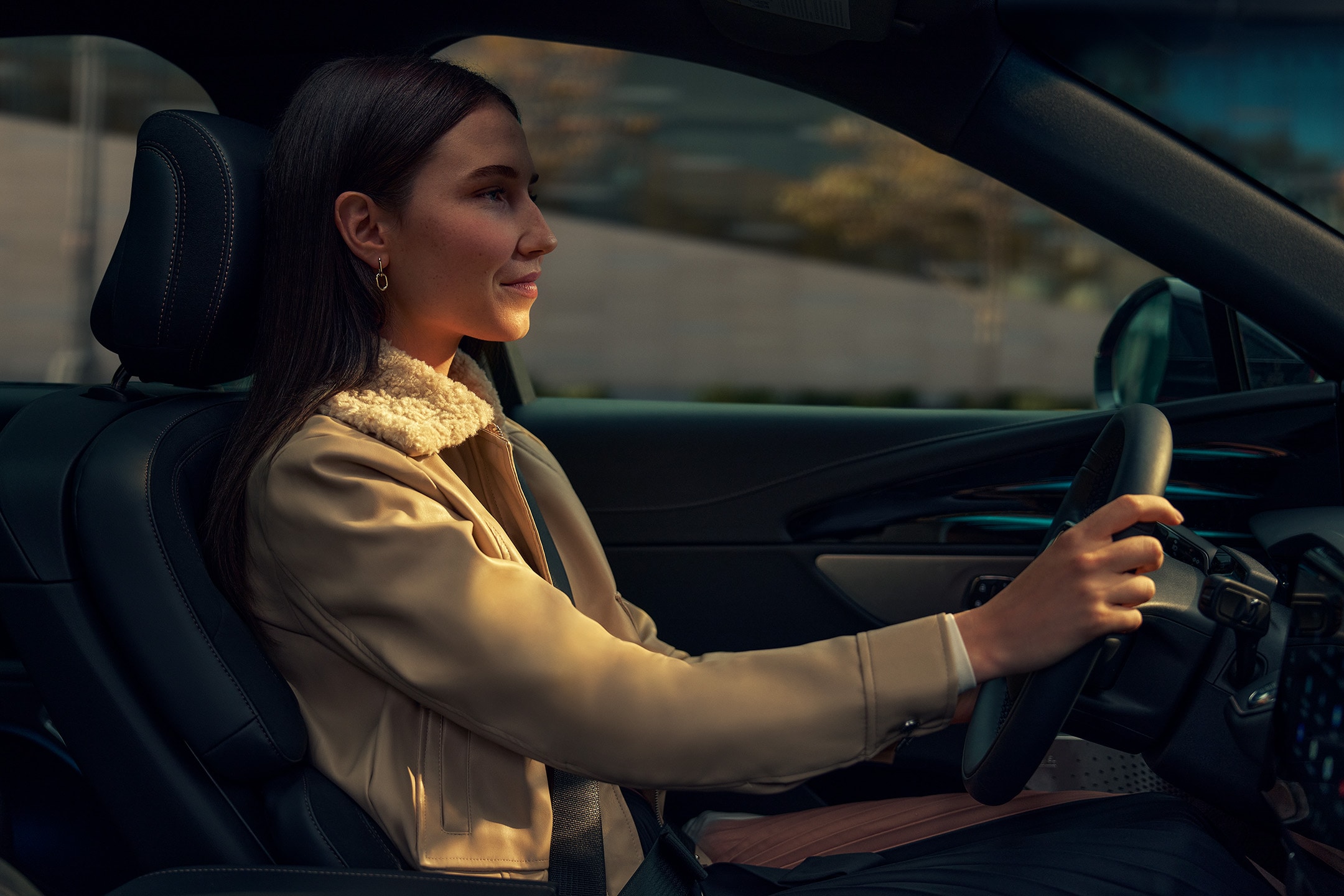 The driver of a parked 2024 Lincoln Black Label Nautilus® SUV takes a relaxing moment.