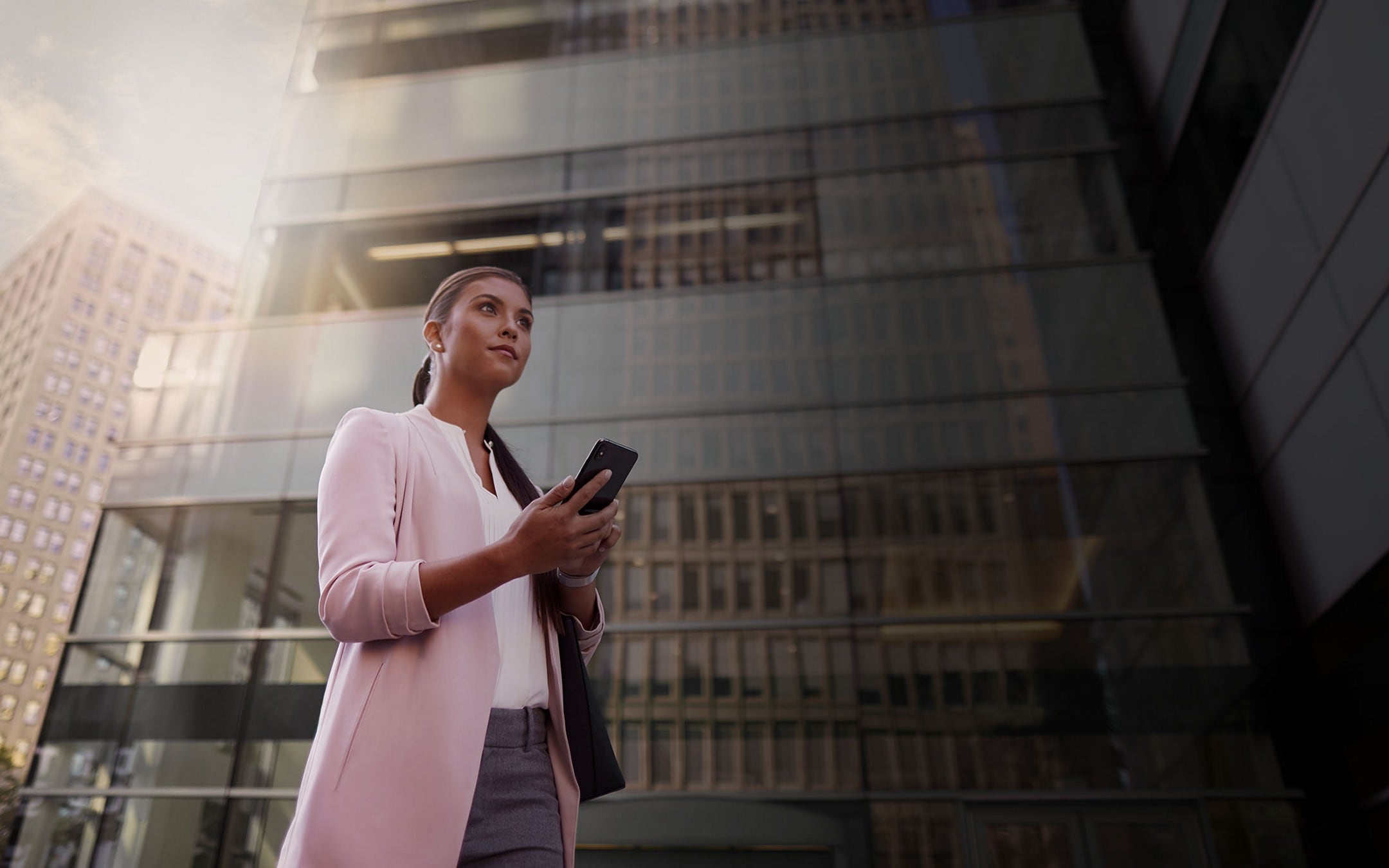 A woman interacts with the Lincoln Way® App on her smartphone.