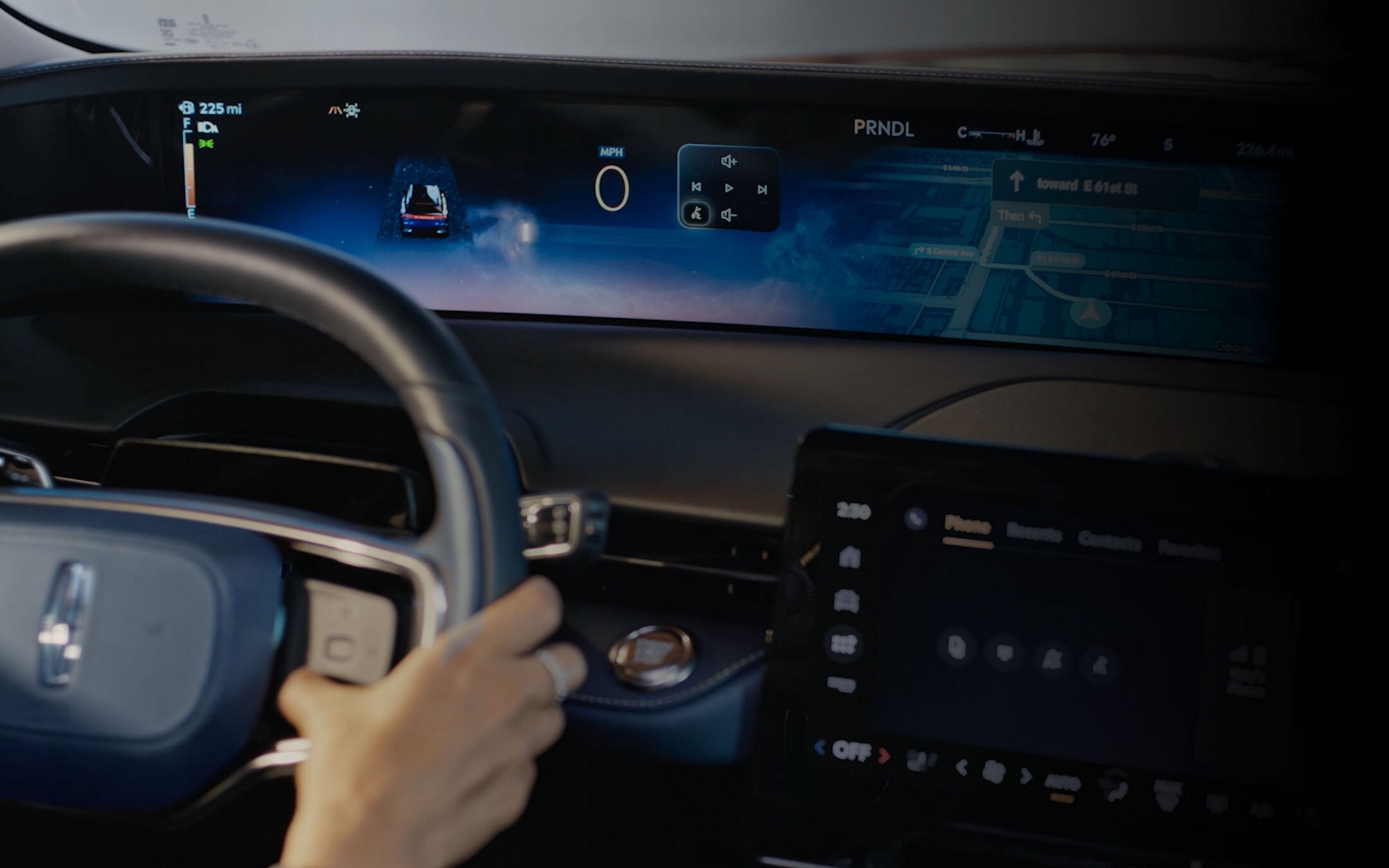 The driver of a 2024 Lincoln Nautilus® SUV interacts with capacitive touch steering wheel controls.