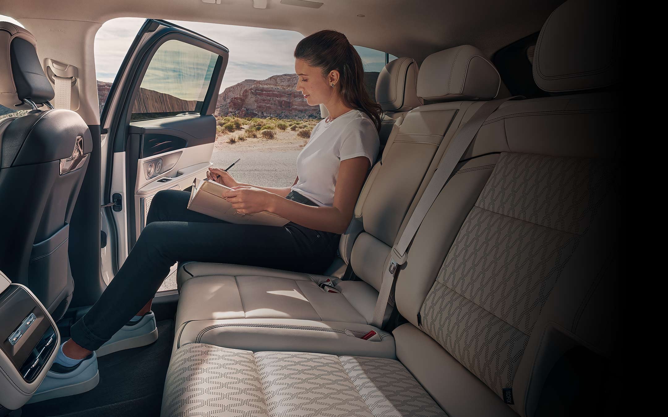 A woman sits in the second row of a 2026 Lincoln Nautilus® SUV