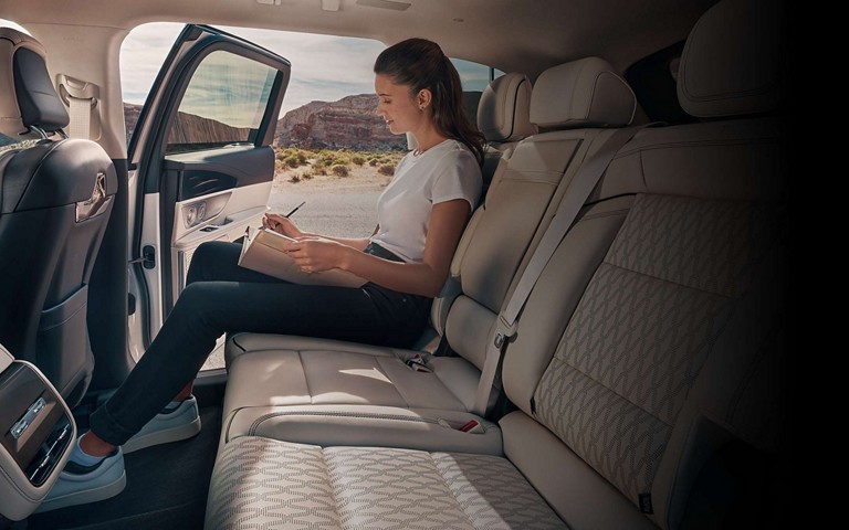 A woman sits in the second row of a 2026 Lincoln Nautilus® SUV
