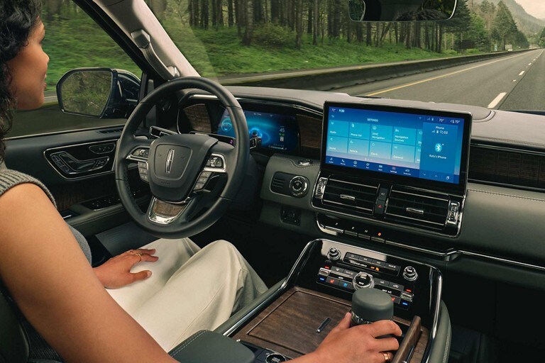 The driver of a 2023 Lincoln Navigator® SUV is relaxing with ActiveGlide™ engaged.