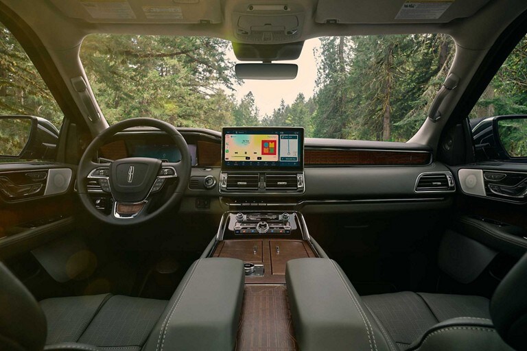 The interior of a 2024 Lincoln Black Label Navigator® SUV in the Central Park theme shows off a luxuriously appointed cabin.
