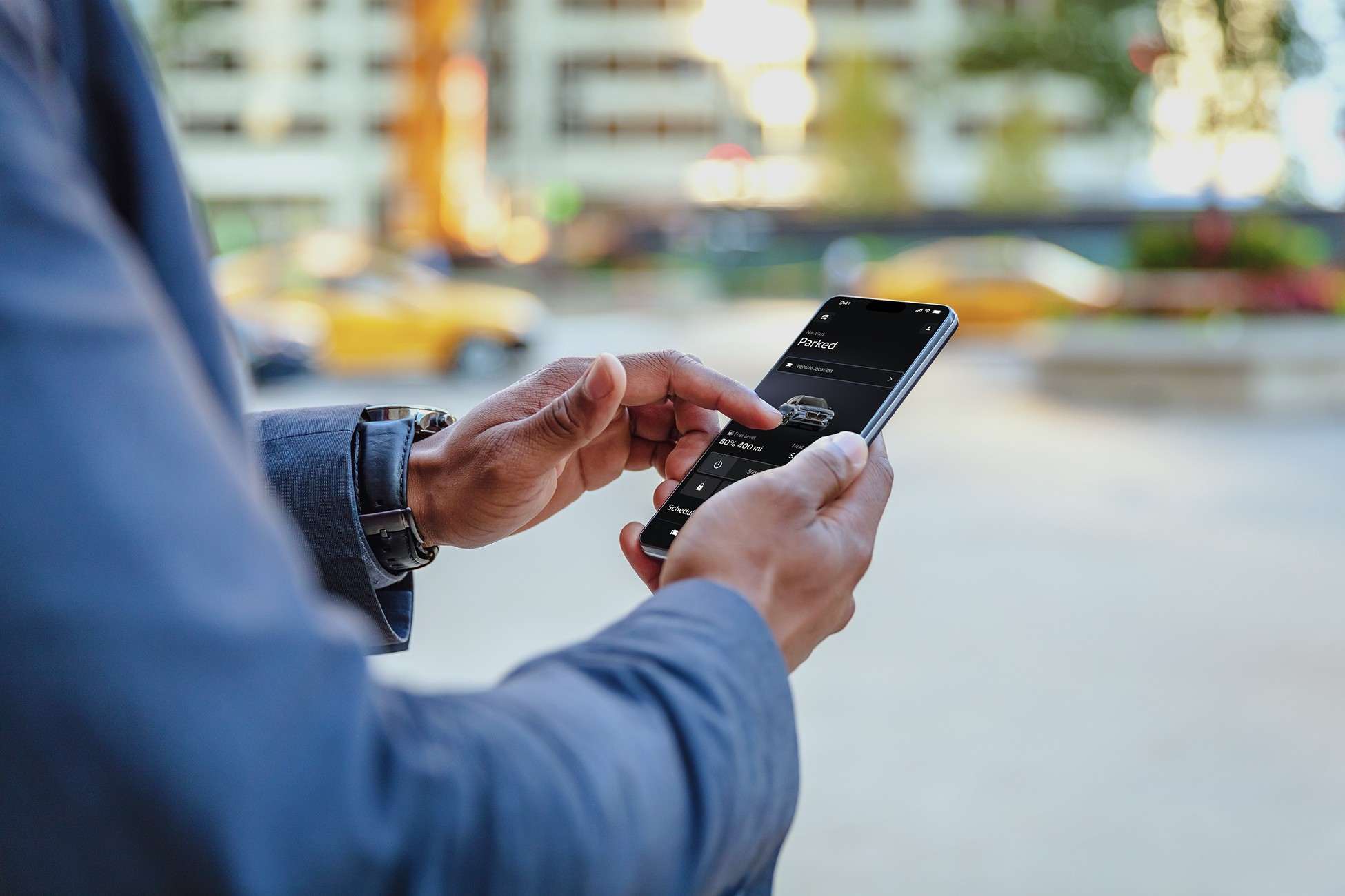 Someone is shown holding a mobile device displaying the Lincoln app.