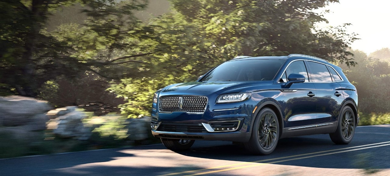 : Luxurious black Lincoln Nautilus driving on the open road