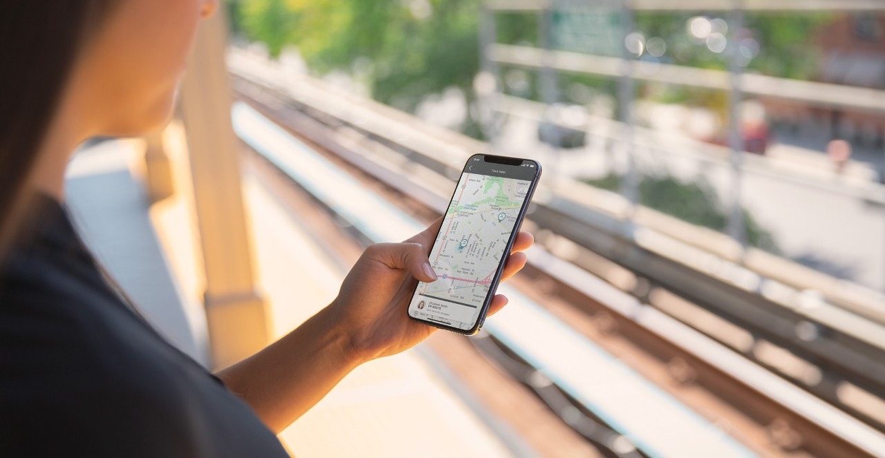 Woman using smart phone to access Lincoln Way App