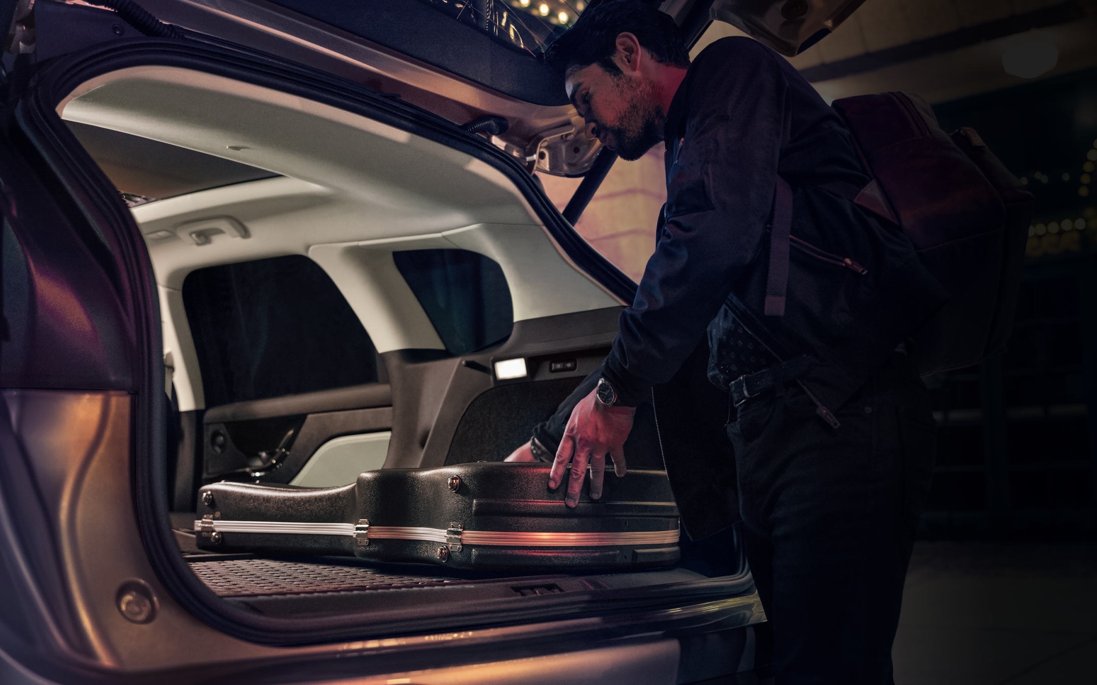 A person loads music equipment into the rear cargo area of a 2026 Lincoln Corsair® SUV
