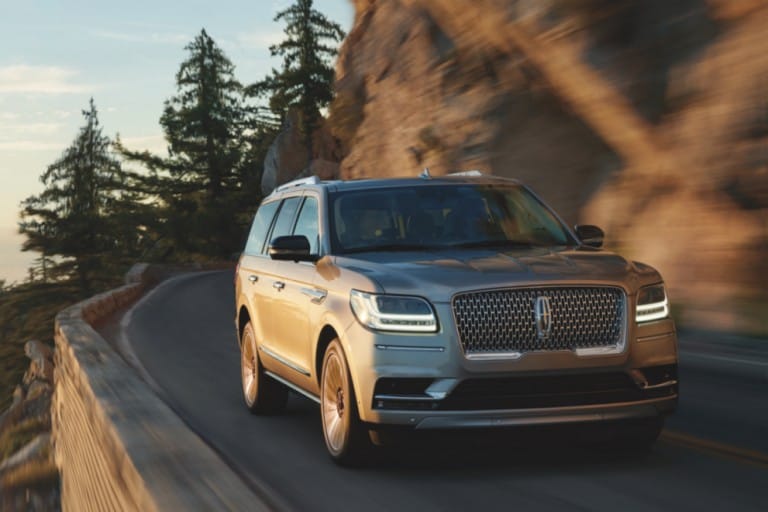 Lincoln Navigator driving on a mountain road