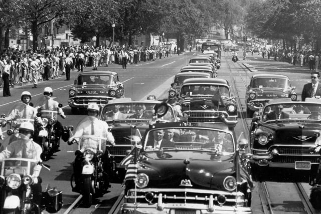A presidential Lincoln motorcade is shown here