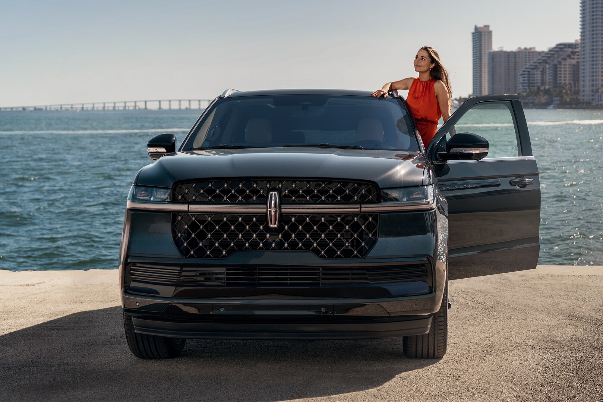 A woman looking out from her Lincoln Navigator.