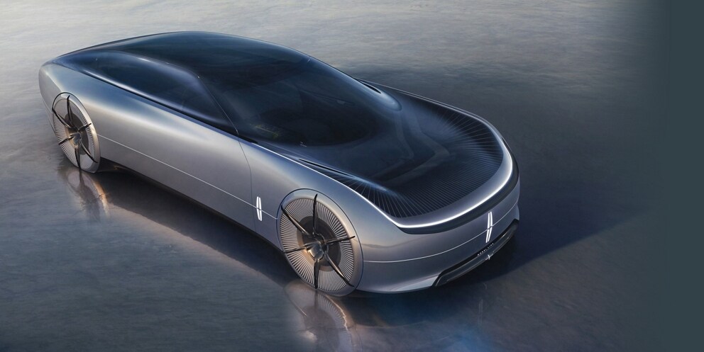 The Lincoln Model L100 concept vehicle is shown here parked on a reflective surface.