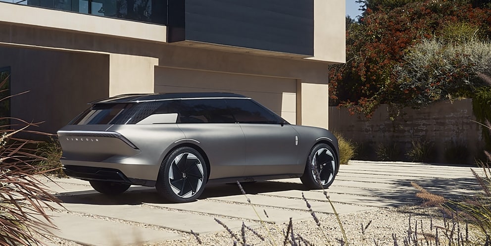 The Lincoln Star Concept vehicle is shown here parked in front of a house.