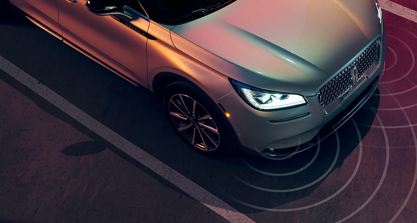 The front of a Lincoln vehicle is shown here using Blind Spot Information System to identity nearby vehicles