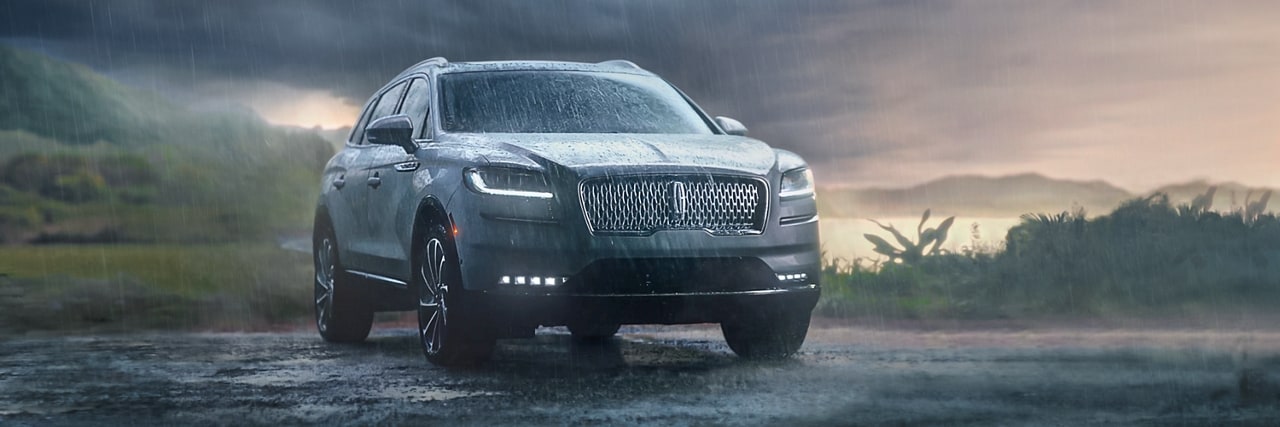 a Lincoln vehicle in heavy rain is shown here