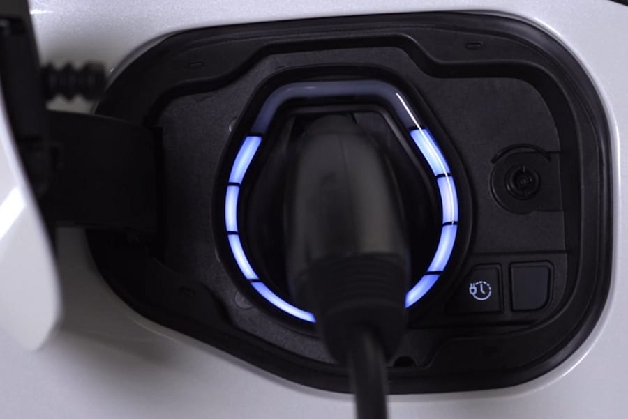 2025 Ford Transit® model with box truck upfit parked in a driveway with two workers walking away from it