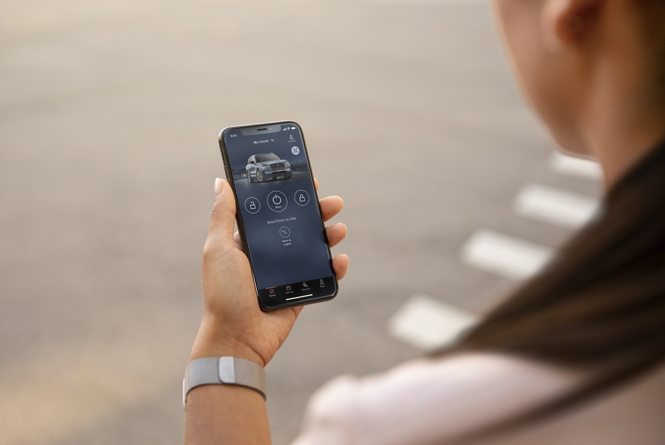 A person holds their smartphone displaying the Lincoln Way® app