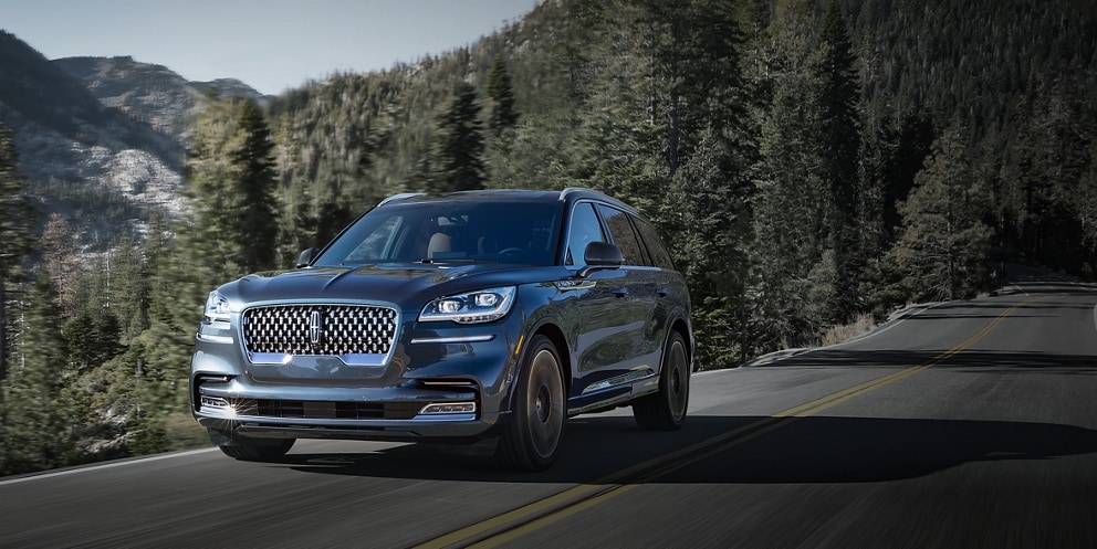 A 2023 Lincoln Aviator® is being driven on a mountain road.