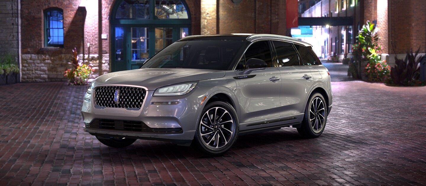 The headlamps of the 2023 Lincoln Corsair® SUV gleam brightly at night