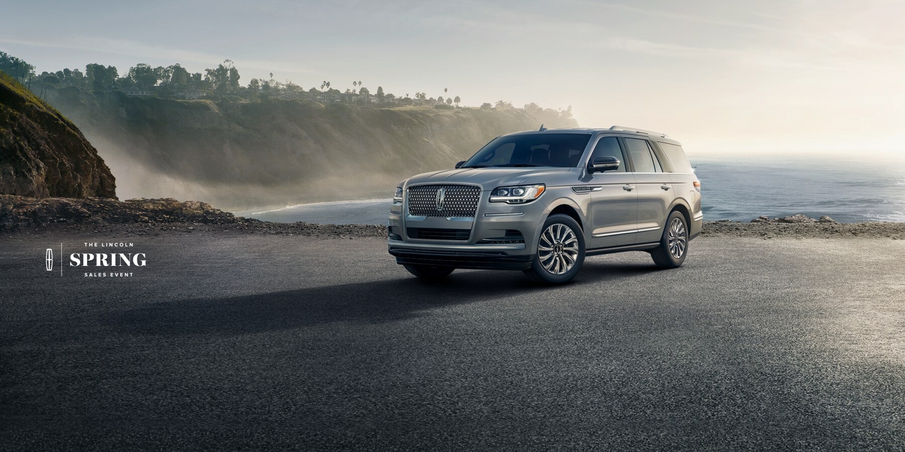 The Lincoln Spring Sales Event. A shot of the 2023 Lincoln Navigator in front of a lake.