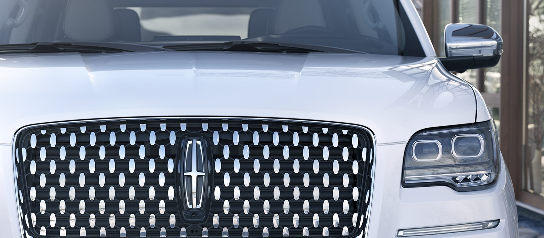 The grille of a Lincoln Navigator.